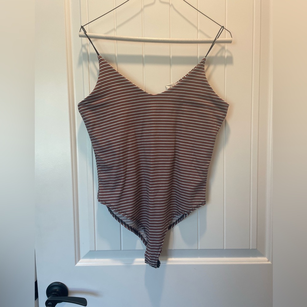 White and coral striped, snap body suit